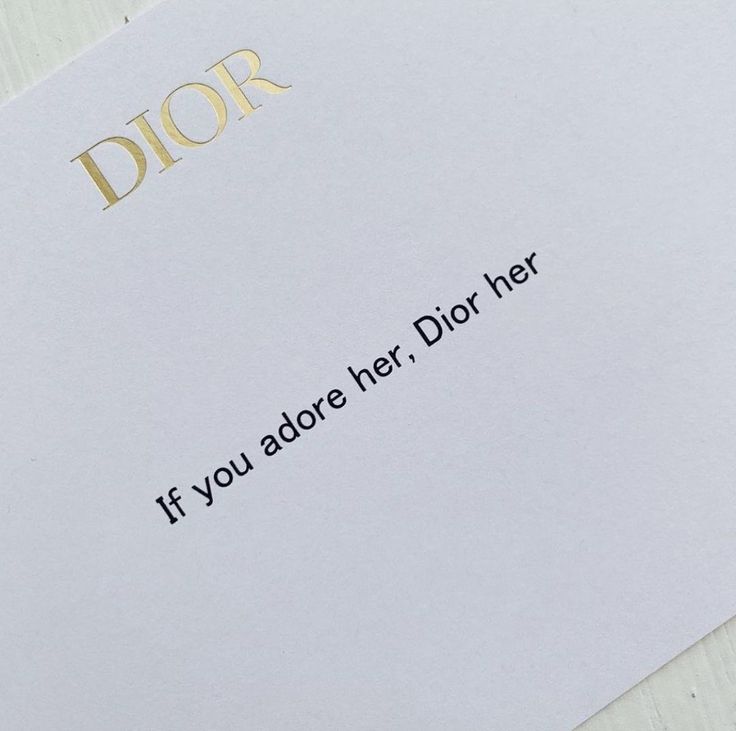 a close up of a piece of paper with the words dior written on it