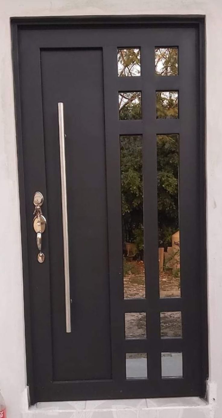 a black front door with two sidelights