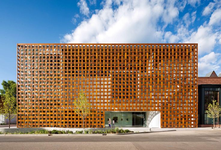 a large wooden building sitting on the side of a road