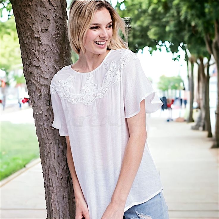 100 Polyester Silky Soft And Lightweight With A Flutter Sleeve And Lace Detailing On The Yoke. Easily Dress This Up Or Down. Model Is Wearing The Small. Imported Visit Euphoriadiscounts.Com To See All Our Inventory. Summer Lace Top Blouse With Short Sleeves, Breezy Short Sleeve Blouse For Day Out, White Breezy Blouse For Spring, Breezy White Blouse For Spring, Short Sleeve Blouse With Lace Trim For Day Out, Spring Lace Top For Day Out With Short Sleeves, Feminine Flowy Tops For Daywear, Flowy Feminine Tops For Daywear, White Casual Airy Blouse