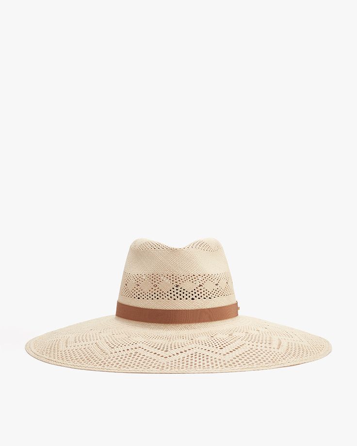 Wide-brimmed hat with perforated pattern and a ribbon band. Woven Straw Panama Hat With Flat Brim, Woven Toquilla Straw Hat With Flat Brim, Handwoven Adjustable Fedora For Vacation, Adjustable Handwoven Fedora For Vacation, Elegant Adjustable Woven Hat Bands, Natural Woven Toquilla Straw Fedora, Natural Woven Fedora, Woven Toquilla Straw Hat Bands For Summer, Summer Fedora Woven From Palm Leaf