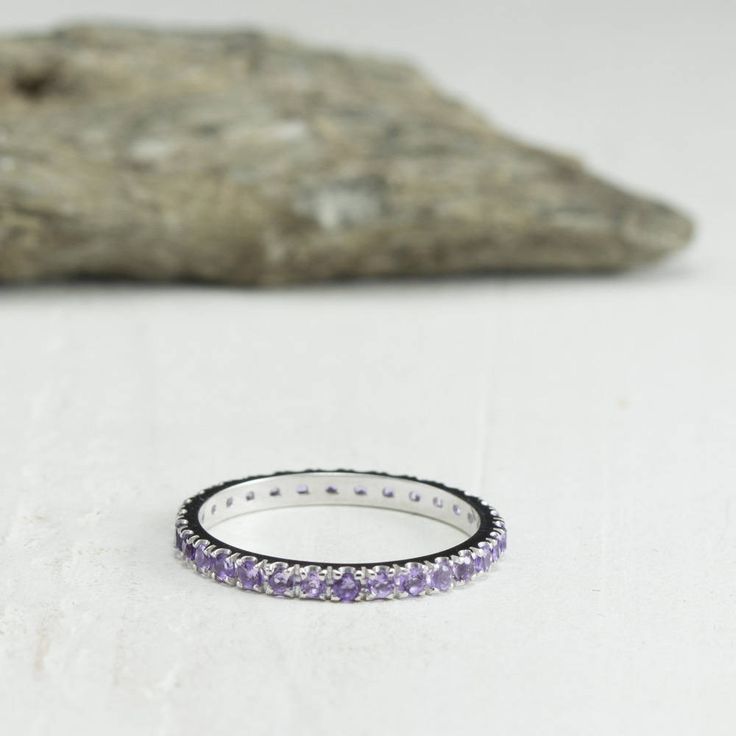 Dainty and beautiful Ring set with 1.75 mm natural Amethyst. Each ring is made to order by an artist with the highest attention to detail. Each gemstone set in this ring is handpicked for consistency and quality. -Handmade to order, Quick shipping, fully insured and traceable online. -Made in Solid Gold, choose between 14/18 Karat. -Custom Gold Color choose between Rose Gold, Yellow Gold and White Gold. -Gemstone information: 1.75 mm round cut Amethyst, stone count subject to ring size. A size 7 Amethyst Halo Rings For Promise, Amethyst Halo Promise Ring, Fine Jewelry Amethyst Halo Promise Ring, Fine Jewelry Amethyst Ring With Halo For Promise, Round Amethyst Halo Ring For Gift, Gift Halo Amethyst Ring, Purple Stackable Promise Ring, Eternity Band With Halo Setting As Gift, Stackable Amethyst Birthstone Promise Ring