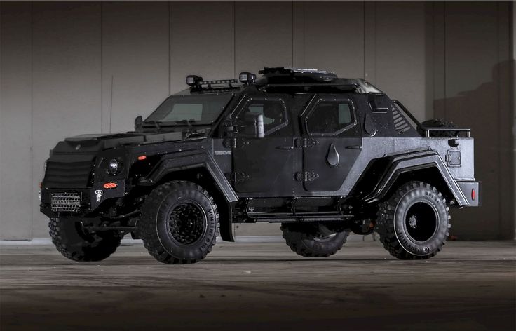 an armored vehicle parked in front of a building