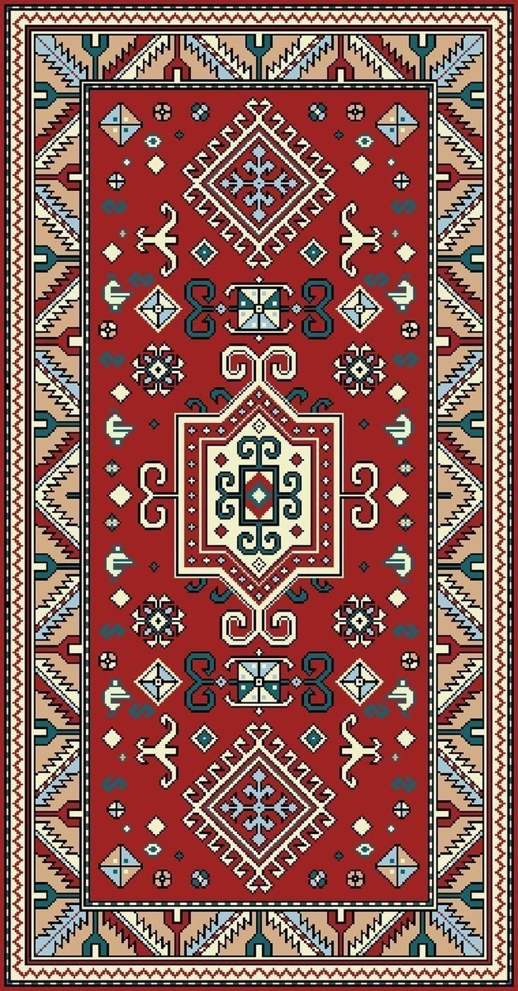 a red and blue rug with an intricate design on the bottom, in different colors