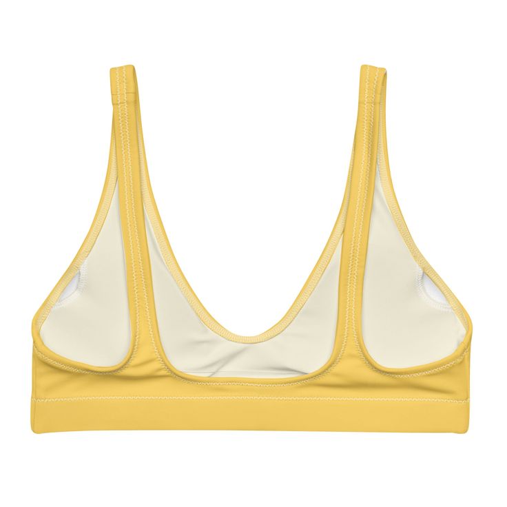 The bright yellow bralette bikini top is your go-to for everything under the sun and in saltwater. This women's swimsuit top is made with recycled fabric and crafted with light support. Features a deep v-neck. • 81% REPREVE recycled polyester, 19% LYCRA XTRALIFE • Fabric weight 7.52 oz • Double-layered and non-reversible • Removable padding • Tear-away care label • Zig-zag stitching Size guide CHEST WAIST HIPS XS (inches) 33 ⅛ 25 ¼ 35 ⅜ S (inches) 34 ⅝ 26 ¾ 37 M (inches) 36 ¼ 28 ⅜ 38 ⅝ L (inches Yellow Beachwear Swimwear With Built-in Bra, Beach Sports Bra Triangle Top, Triangle Top Fitted Sports Bra For Beach, Triangle Top Sports Bra For The Beach, Fitted Triangle Top Sports Bra For Beach, Triangle Top Sports Bra With Removable Pads, Fitted Triangle Top Sports Bra For Vacation, Beach Triangle Top Sports Bra With Padded Cups, Summer Beach Sports Bra With Padded Cups