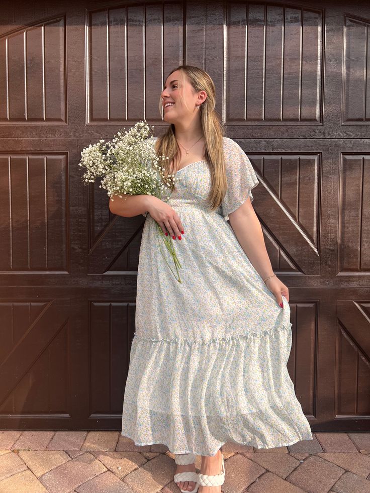 The perfect Easter and spring time dress. Beautiful floral pattern and pastels. This flowy dress makes you feel like you're in a fairytale. Double lined dress Side Zipper to help get in and out of dress Elastic back, more comfortable and breathable *Model is 5'2 bra size 34DD wearing size medium* Flowy Ditsy Floral Dress For Garden Party, Flowy Ditsy Floral Print Dress For Casual Occasions, Flowy Ditsy Floral Print Dress For Casual Wear, Casual Flowy Ditsy Floral Dress, Spring Floral Print Maxi Dress With Flowy Skirt, Spring Breezy Maxi Dress With Flowy Skirt, Spring Breezy Maxi Dress With Floral Print, Breezy Spring Maxi Dress With Floral Print, Feminine Flowy Sundress For Casual Occasions