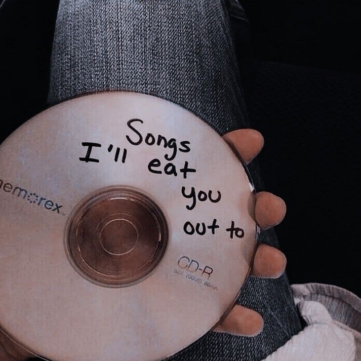 someone holding a cd with the words songs i'll eat you out to