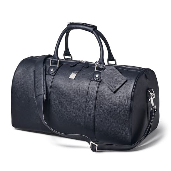 Boston Leather Travel Bag in Navy Pebble Classic Business Travel Bag In Textured Leather, Luxury Duffle Bag For Weekend Trips, Luxury Duffle Bag With Luggage Sleeve For Overnight Trips, Classic Weekender Bag With Leather Trim For Business Trips, Classic Business Duffle Bag With Textured Leather, Luxury Duffle Bag For Overnight Trips, Luxury Business Travel Bag With Leather Trim, Classic Textured Leather Duffle Bag For Business Trips, Classic Textured Leather Weekender Bag For Business