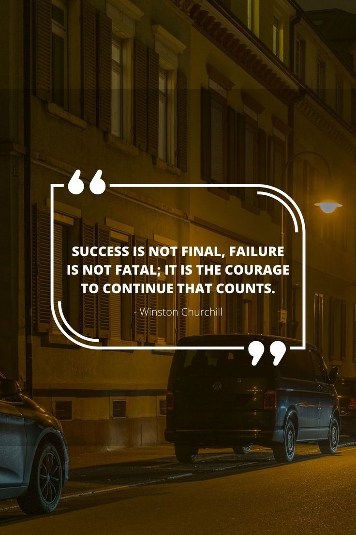 two cars parked on the side of a street at night with a quote about success