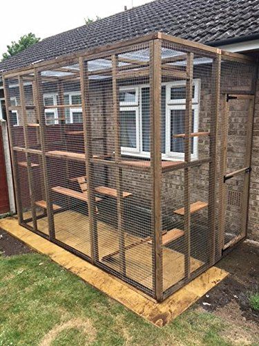 a house with a chicken cage on the outside