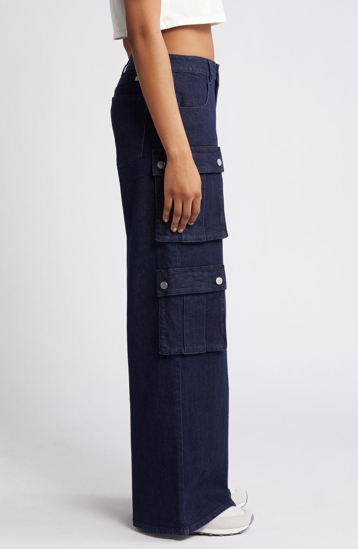 Classic cargo pockets give utilitarian appeal to these wide-leg jeans crafted from breathable low-stretch denim. 33" inseam; 25 1/2" leg opening; 10 1/2" front rise; 15" back rise Zip fly with button closure Front scoop pockets; cargo snap-patch pockets 99% cotton, 1% spandex Machine wash, tumble dry Imported Denim Blue Utility Flare Jeans, Utility Flare Jeans With Five Pockets In Denim Blue, Utility Style Wide Leg Flare Jeans With Patch Pockets, Denim Blue Jeans With Flap Pockets For Work, Spring Wide Leg Jeans With Flap Pockets, Medium Wash Wide Leg Utility Cargo Pants, Utility Wide Leg Medium Wash Cargo Pants, Medium Wash Wide Leg Cargo Jeans With Patch Pockets, Utility Style Full Length Flare Jeans With Patch Pockets