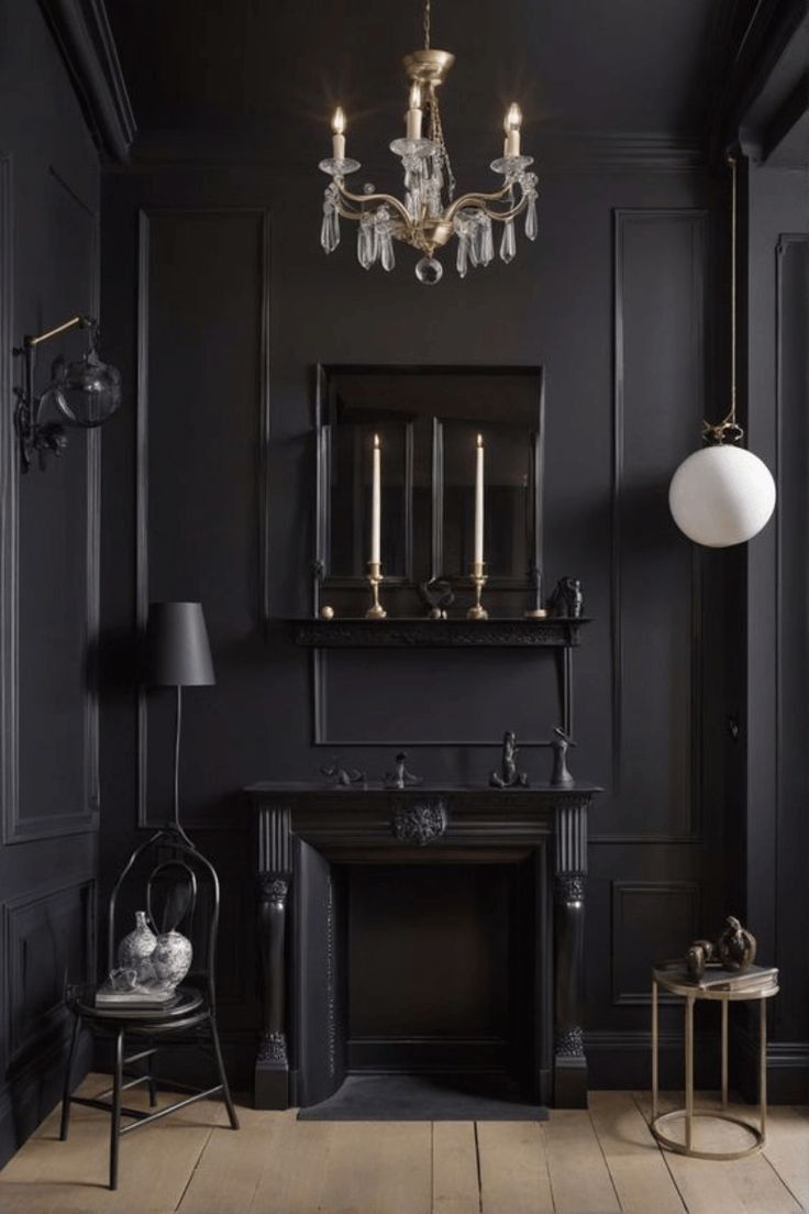 an elegant black room with gold accents and chandelier