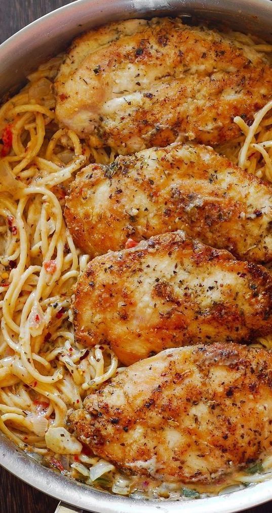 some chicken and noodles in a pan on a table