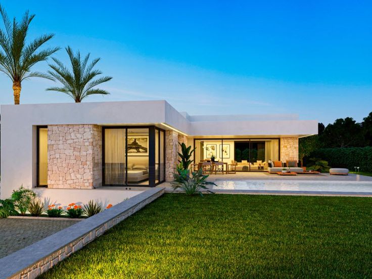 a modern house with a pool and palm trees