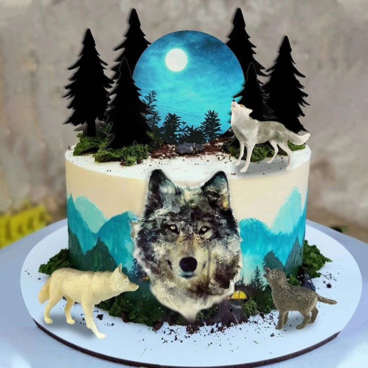 a cake decorated with an image of a wolf and other animals