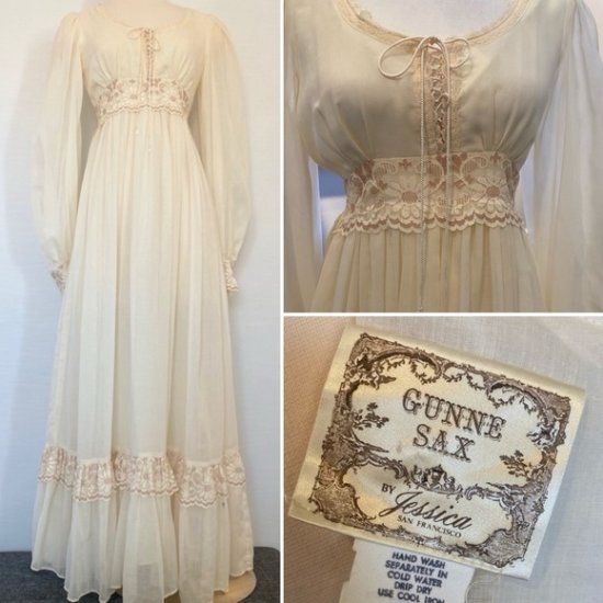 the dress is white and has lace trims on it, along with an old book