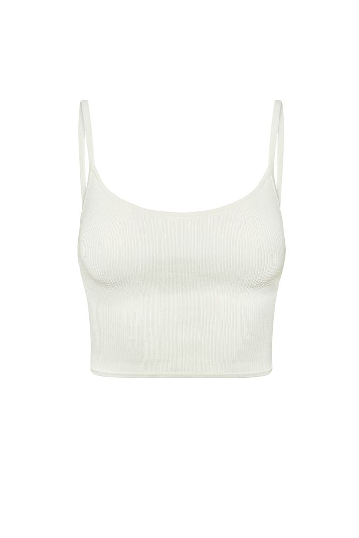 Must-have essential The Beverly Hills Top will be your summer essential. This rib knit cami features a scoop neckline, adjustable shoulder straps and a cropped fit that is perfect for all day wear.Features:Crop fitAdjustable strapsRib knit*Note, that white rib is a soft hue that some have found to be sheer Care:Hand wash cold separately, lay flat to dry or dry clean. Do not bleach. This garment is very delicate. In order to minimize snagging, please avoid rough surfaces and be careful when weari Everyday Scoop Neck Seamless Crop Top, Seamless Cropped Tank Top, Casual Seamless Crop Top For Everyday, Everyday Solid Scoop Neck Crop Top, Everyday Solid Color Scoop Neck Crop Top, Seamless Scoop Neck Crop Top For Loungewear, Casual Crop Top With Built-in Bra For Everyday, Casual Scoop Neck Seamless Camisole, Casual Seamless Scoop Neck Crop Top