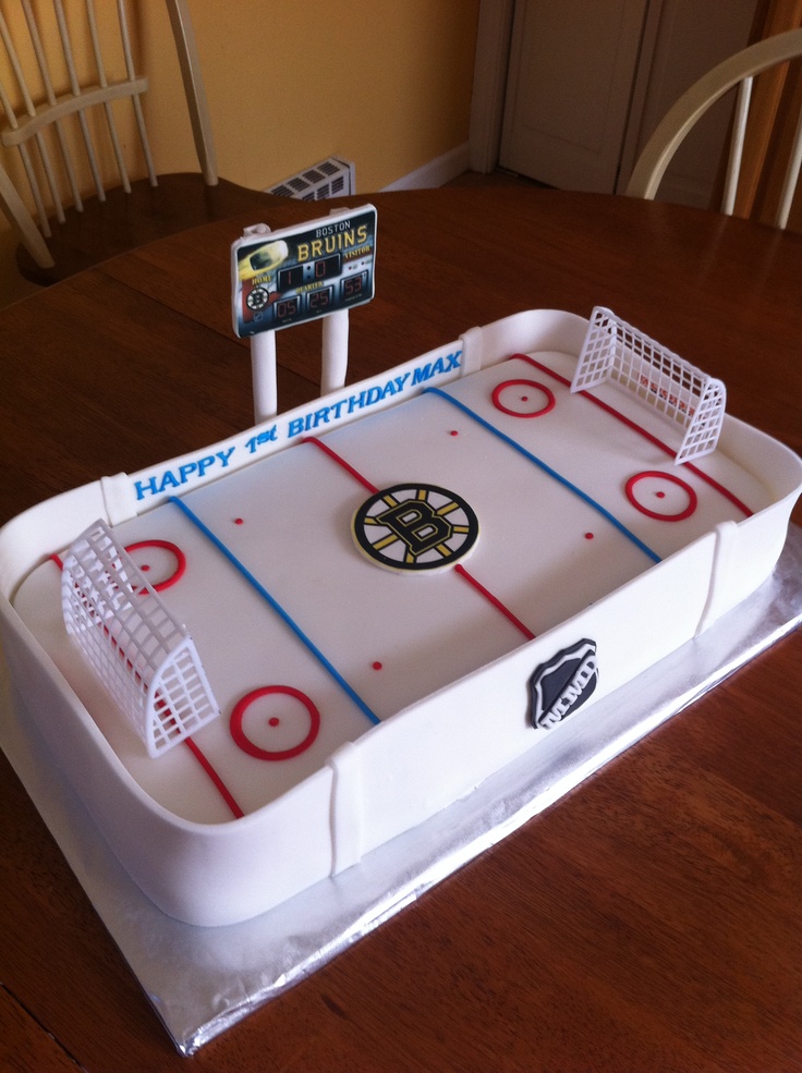 a birthday cake with an ice hockey rink on it