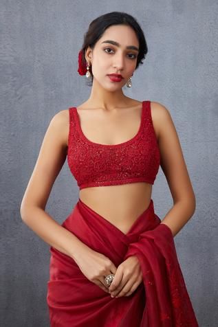 Red backless blouse with all-over floral motif hand embroidery, placement sequin embellishments and tassel tie-up back.
Components:1
Embroidered
Neckline:U Neck
Sleeve Length:Sleeveless
Fabric:Silk Organza
Color:Red
Tassel tie-up back
Closure: Back hooks
Note: Saree worn by the model is not for sale - Aza Fashions Sleeveless Blouse Designs, Sleeveless Blouse Saree, Red Sleeveless Blouse, Saree Blouses Online, Women Saree, New Saree Blouse Designs, Backless Blouse, Saree Blouses, Unique Blouse Designs