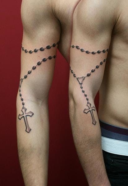 two men with rosary tattoos on their arms