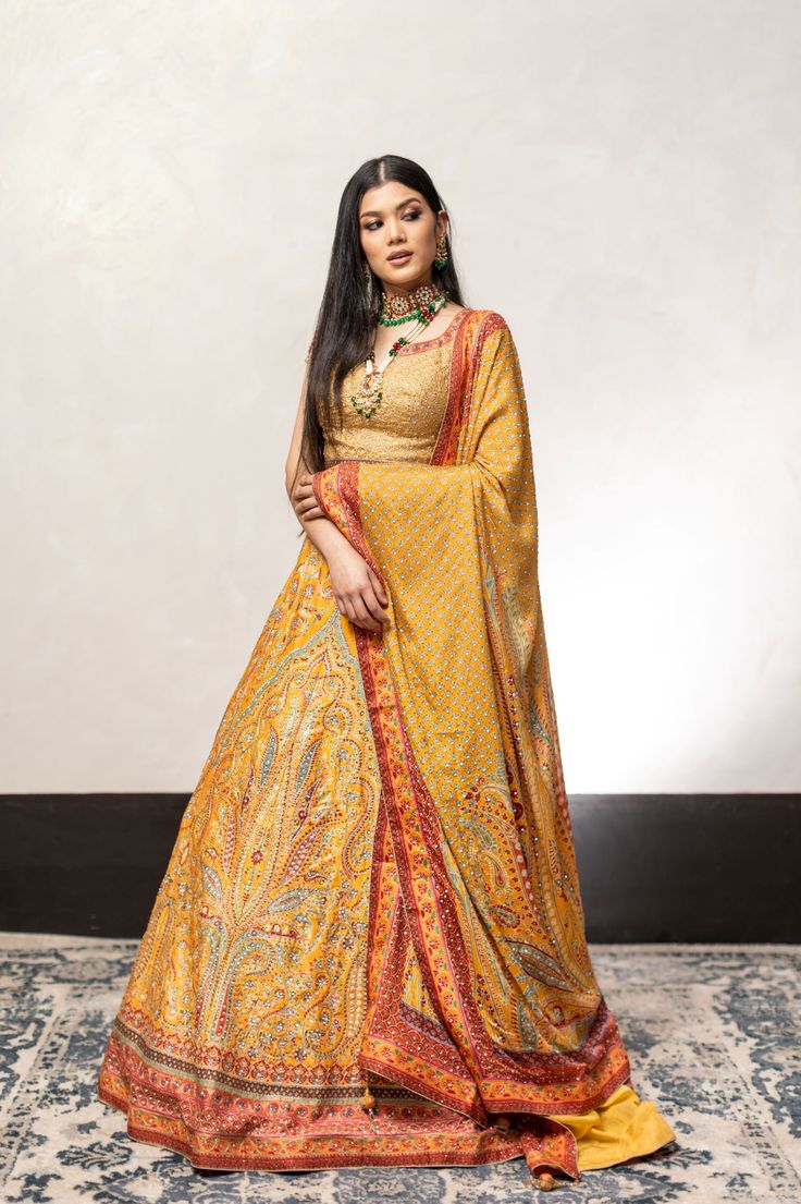 Yellow Color Swarovski Work Wedding Lehenga – Panache Haute Couture Semi-stitched Yellow Lehenga With Motifs, Yellow Semi-stitched Lehenga With Motifs, Semi-stitched Gold Anarkali Set With Motifs, Yellow Festive Sets With Motifs, Festive Yellow Sets With Motifs, Festive Yellow Lehenga With Motifs, Festive Yellow Sharara With Motifs, Gold Anarkali Choli In Jamawar, Yellow Anarkali Choli With Motifs