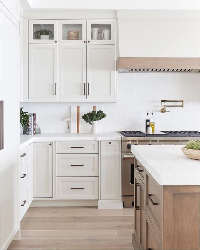 the kitchen is clean and ready for us to use it's white countertops