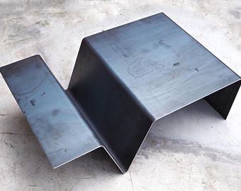 a metal object sitting on top of a cement floor