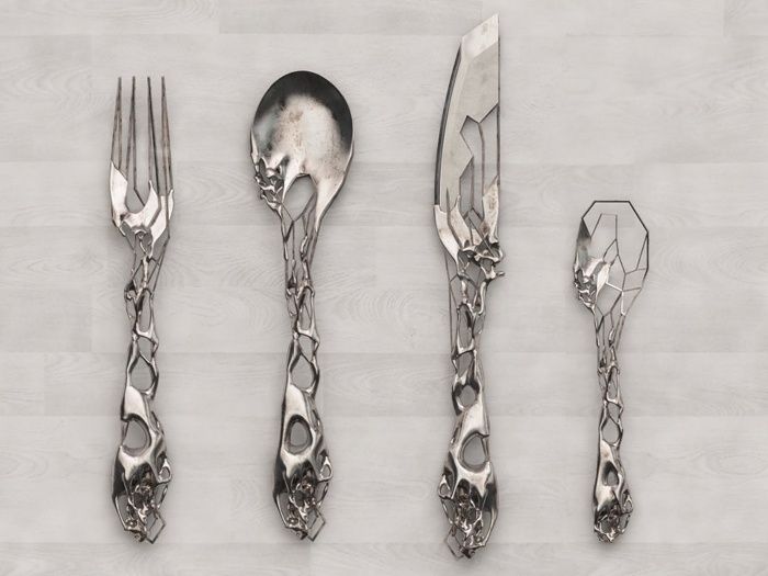 four forks, two knives and three spoons on a table