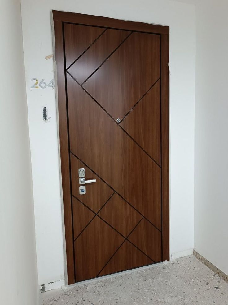 a wooden door in the corner of a room