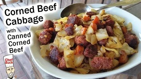 a bowl filled with meat and vegetables on top of a table