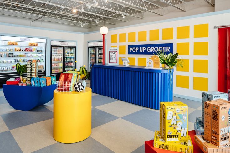 the inside of a grocery store with colorful displays