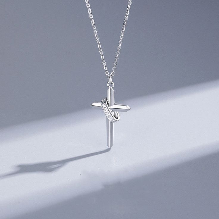 Description & Details Embrace the timeless symbol of faith, spirituality, and devotion with our exquisite pieces inspired by the sacred cross. Each design in our collection is meticulously crafted to honor the significance of the cross and serve as a beautiful reminder of one's beliefs and values. • Material: Solid 925 Sterling Silver • Finish: Hypoallergenic ∙ Gold Plating• Dimensions: 1.46 × 1.6 cm for female, 1.73 × 3.0 cm for male, 40 - 45 cm chain, adjustable• All our work is custom made by Minimalist Cross Pendant Necklace With Clavicle Chain, Minimalist Cross Pendant Necklace As Gift, Spiritual Cross Necklace With Adjustable Chain, White Cross Pendant Necklace With Clavicle Chain, Spiritual Clavicle Chain Cross Pendant Necklace, Minimalist Crucifix Jewelry With Adjustable Chain, White Cross Necklace With Clavicle Chain, Elegant Cross Necklace With Adjustable Chain, Elegant Silver Crucifix Necklace