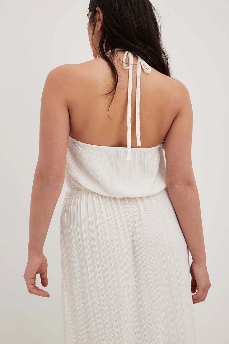 Pleated Flowy Midi Dress Offwhite | NA-KD White Pleated Summer Dress, Chic Halter Neck Top For Brunch, Chic Halter Neck Dress For Brunch, Halter Neck Dress With Gathered Neckline For Date Night, Beach Halter Neck Dress Pleated, Chic White Halter Top For Date Night, Beach Pleated Halter Neck Dress, Beach Pleated Halter Dress, White Halter Neck Dress With Tie Back