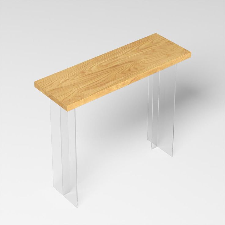 a wooden bench sitting on top of a white floor next to a glass leg vase