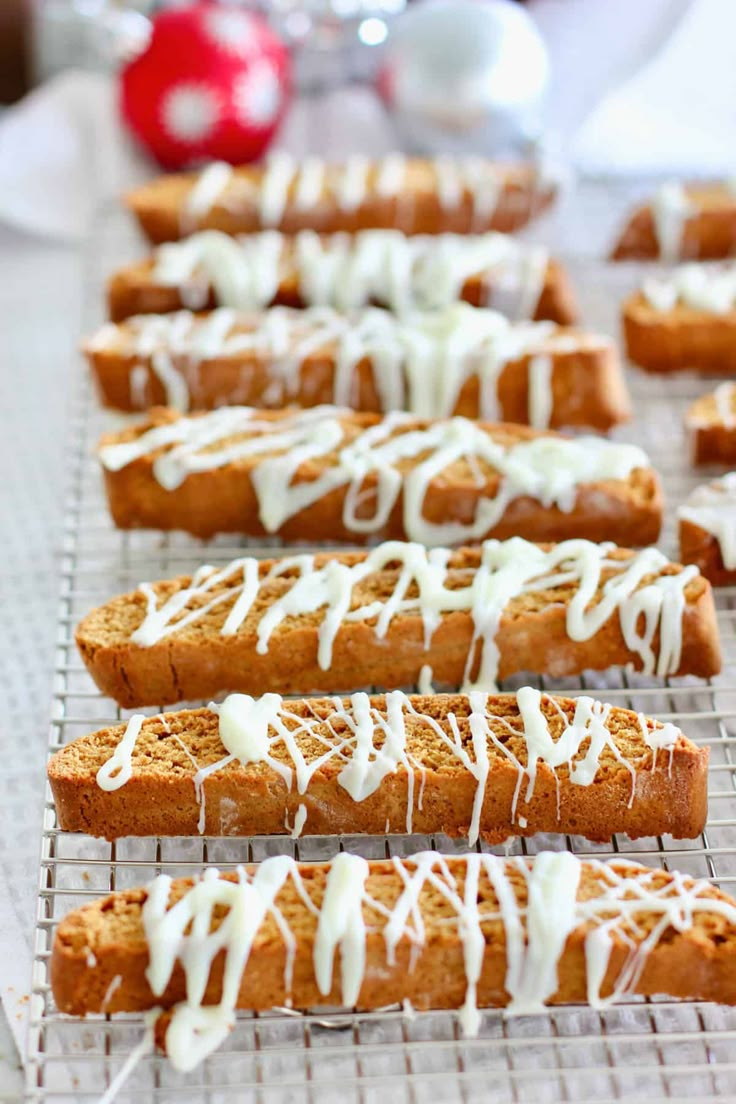 an easy recipe for gingerbread biscotti with white icing on top and drizzled