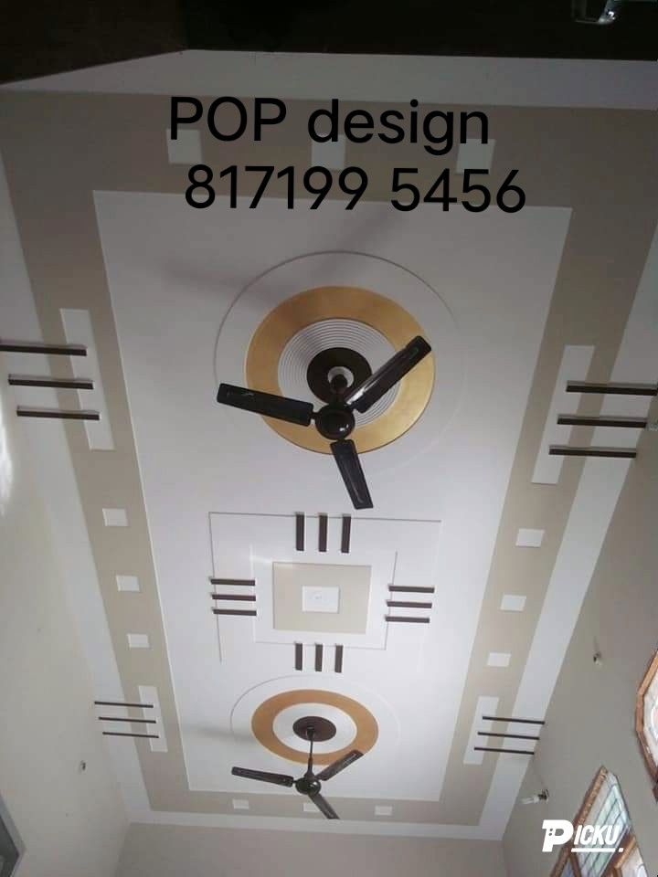 there is a large clock on the ceiling in this building that says pop design 81799 546