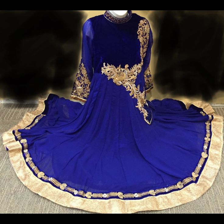 This Dress Has Never Been Worn. It Is New In Its Original Packaging. It Is A Royal Blue With Golden Zarri Work Gown Dress. The Neck Is Beautifully Embellished, The Top Part Of The Dress Is Velvet And Then The Rest Of The Dress Is Georgette Material. This Dress Includes A Stole, And A Legging. It Is A Size Small Dress. The Dress Is Beautiful In Person! I Bought It For Me But It Doesn’t Fit Me! Traditional Drape Dresses With Zari Work For Evening, Traditional Drape Evening Dresses With Zari Work, Traditional Drape Zari Work Evening Dresses, Anarkali Evening Dress With Traditional Drape, Evening Anarkali Dress With Traditional Drape, Anarkali Dress With Traditional Drape For Evening, Blue Evening Dress With Traditional Drape, Party Wear Embroidered Dresses, Elegant Blue Gown With Traditional Drape