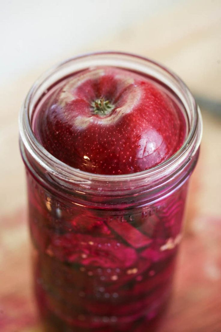 an apple is in a jar on the table