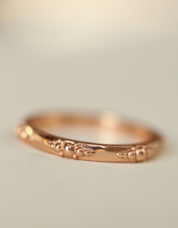 Heavenly Gold Ring
She's a symbol of Love, Faith & Hope, heavenly gold band with her joyful pattern around the entire band.  Thoughtfully crafted stacking ring pairs with other Erin Pelicano rings, or as a band worn in her own beauty. Created to last a lifetime. Stack one for each child, stack one for each of your favorite people, collect one for each milestone, or wear as your wedding band.

Designed and crafted in solid 14k gold, choose from white, yellow, or rose gold.

 	14k Gold Rose Gold Promise Ring With Decorative Band, Heirloom Rose Gold Stackable Rings As Gift, Heirloom Rose Gold Stackable Rings Stamped 14k, Promise Engraved Ring With Decorative Band, Engraved Promise Ring With Decorative Round Band, Luxury Stackable Bands As A Gift, Luxury Stackable Bands For Gift, Luxury Stackable Bands As Gift, Fine Jewelry With Decorative Band For Promise