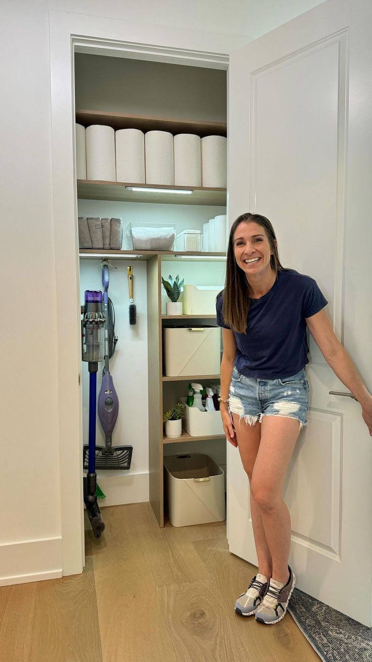 a woman standing in front of a closet