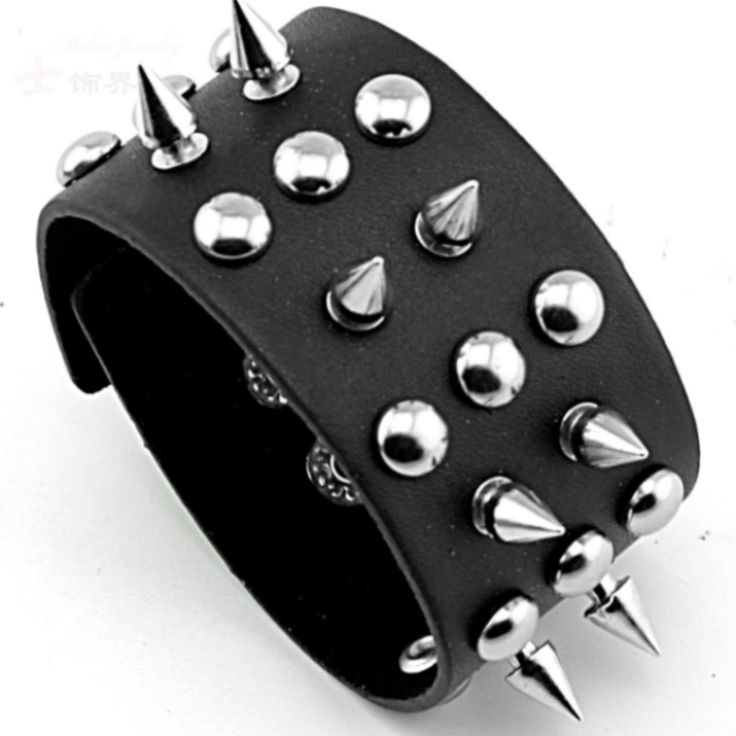 CindyDo you want to add a punk rock accessory to your biker collection that will turn heads everywhere you go? If so, these Badass Rockstar Bracelets w/ Metal Spikes are everything you’re looking for, and more. Made of high-quality PU leather and sturdy alloy, these Badass Rockstar Bracelets w/ Metal Spikes are extremely durable and comfortably fit on your wrist. Because of the quality of the materials, these Badass Rockstar Bracelets w/ Metal Spikes will keep their good shape for a very long ti Punk Style Jewelry For Halloween Concert, Adjustable Punk Bracelet For Streetwear, Adjustable Punk Bracelets For Streetwear, Black Band Wristband For Concerts, Adjustable Black Punk Wristband, Trendy Adjustable Spiked Bracelets, Black Punk Bracelets For Festival, Punk Leather Bracelet With Studs For Festivals, Punk Black Bracelets With Spikes