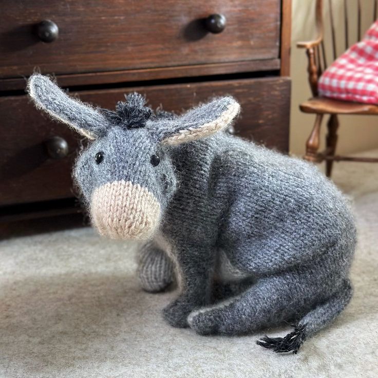 a stuffed animal is sitting on the floor