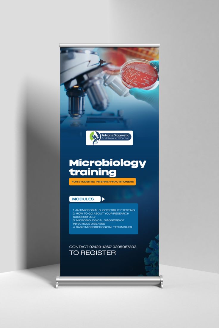 a roll up banner with the words microbiology training on it