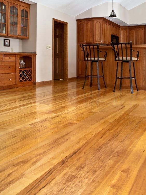 two bar stools sitting on top of a hard wood floor