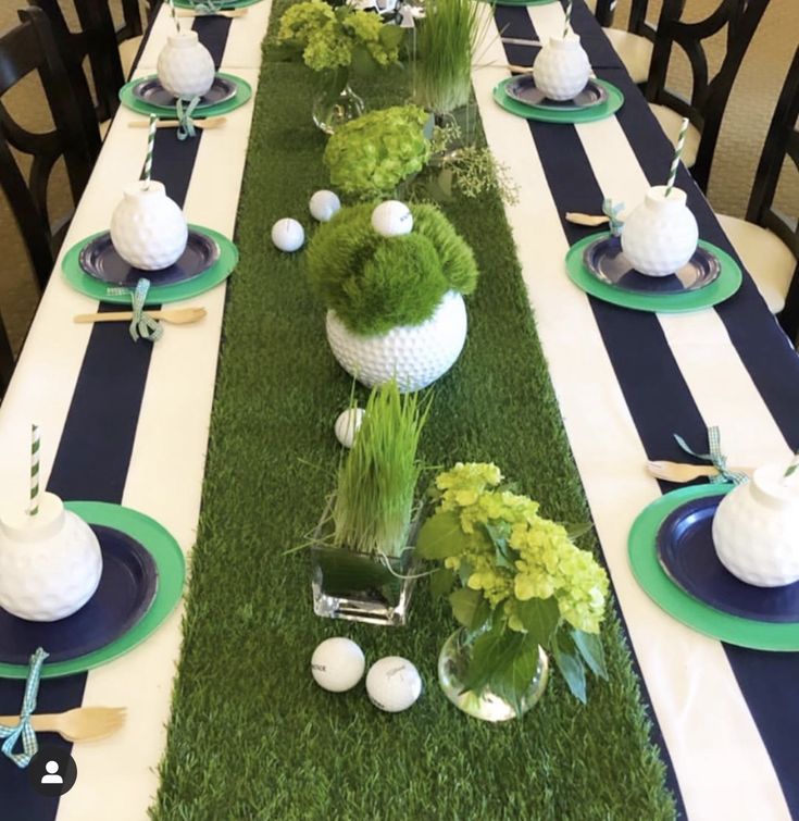 the table is set with blue and white striped runneres, green centerpieces, and golf balls