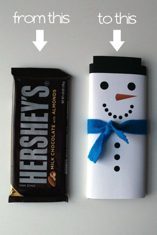 a chocolate bar wrapped in white paper with a snowman on it and the words hershey's next to it