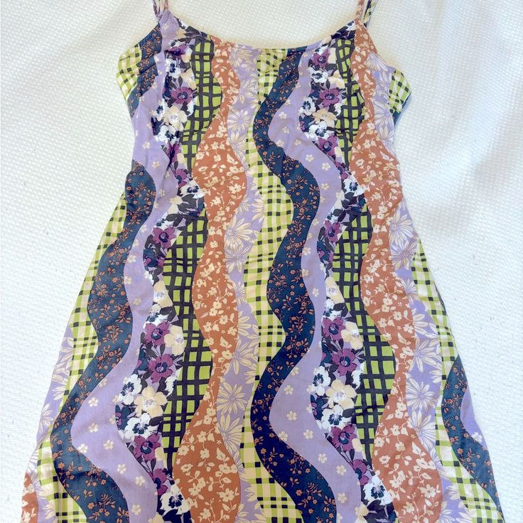 Never Worn. No Damage Trendy Purple Mini Dress For Day Out, Casual Purple Mini Dress For Day Out, Purple Summer Sundress For Day Out, Casual Purple Sundress For Day Out, Purple Sundress For Beach Spring Season, Fitted Patterned Mini Dress For Beach, Fitted Patterned Mini Dress For The Beach, Purple Sleeveless Sundress For Summer, Purple Floral Print Sundress For Vacation