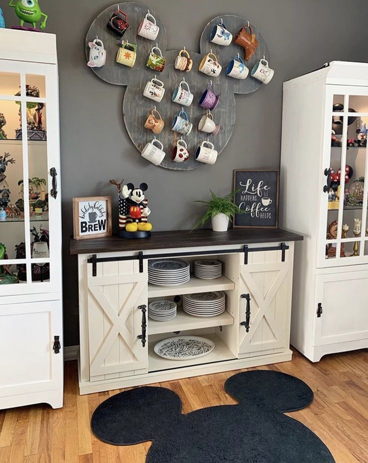 a mickey mouse themed room with plates and cups