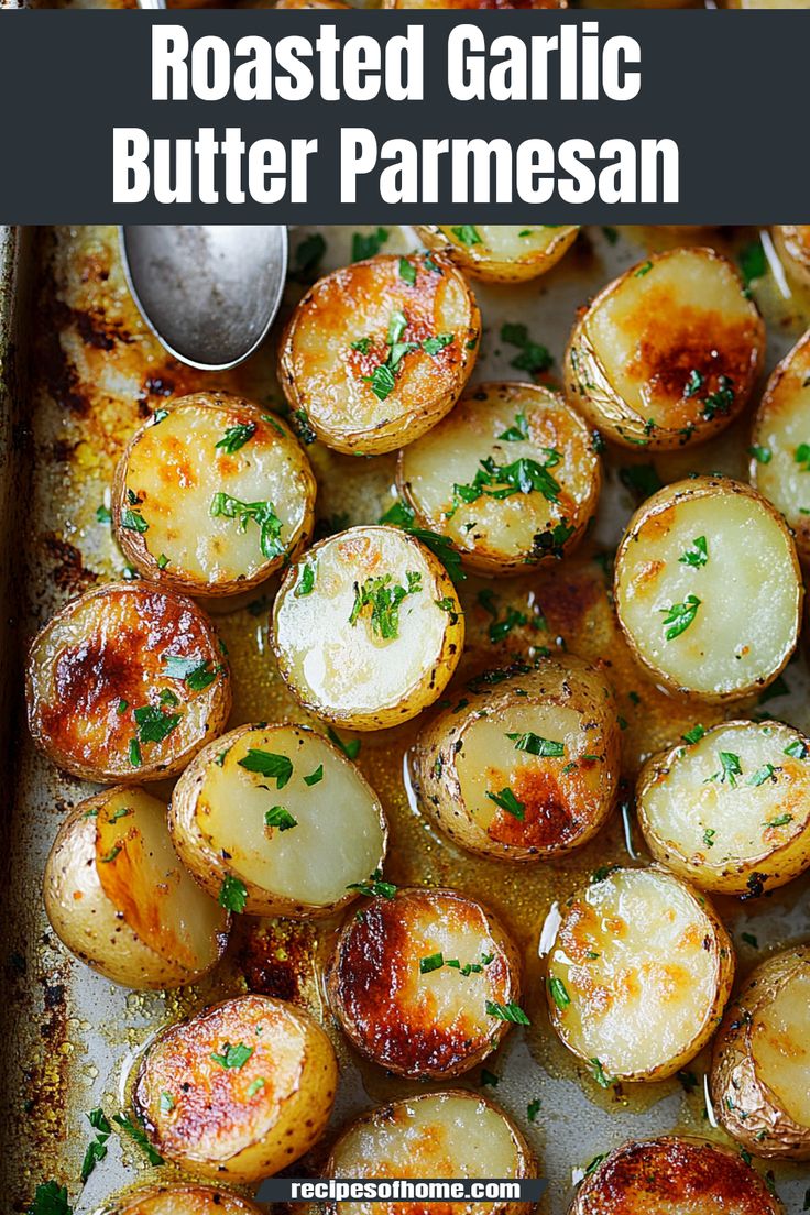 roasted garlic butter parmesan potatoes on a baking sheet