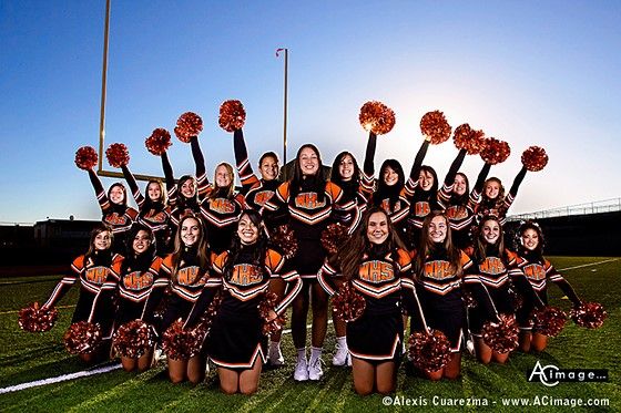 the cheerleaders are posing for a photo